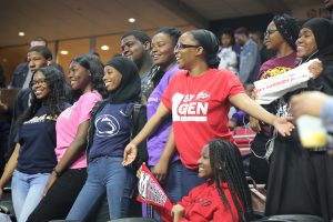 Students wearing college shirts