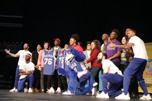 Students on stage with 76ers mascot