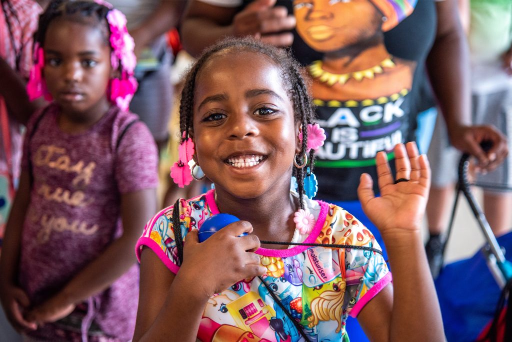 Girl waving Back to School