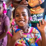 Girl waving Back to School