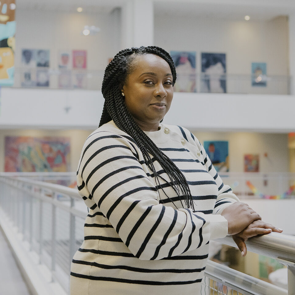 Jenna Monley, Deputy Chief of Family and Community Engagement at Philadelphia Public Schools, stands for a portrait in the office of the Philadelphia School District in downtown Philadelphia, Pennsylvania on Wednesday, December 15, 2021. Monley, who holds an MBA, oversees many departments including family engagement liaisons, coordinating school advisory councils, management pregnant and parenting student services, as well as helping families where English is a second language. 
(Michelle Gustafson for Education Week)