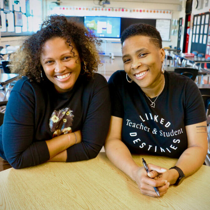 Philadelphia teachers Shalisha Smith (left) and Tamala Anderson are sisters-in-law who support each other. Smith is a first-year teacher and Anderson is a veteran teacher at Strawberry Mansion High School. (Emma Lee/WHYY)