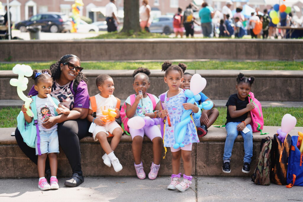 Cluster of young kids in bright clothes