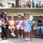 Cluster of young kids in bright clothes